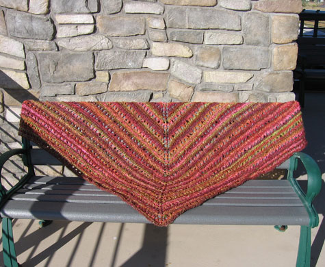 The shawl on a bench.