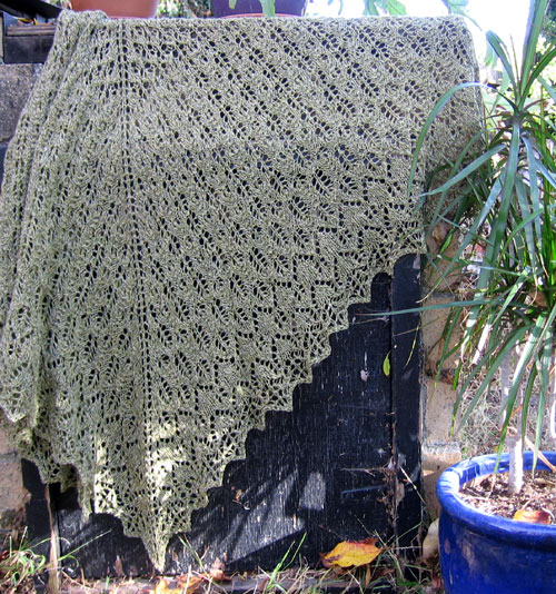 The Pangea shawl draped on the barbecue