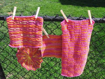 Pink washcloths all in a row.